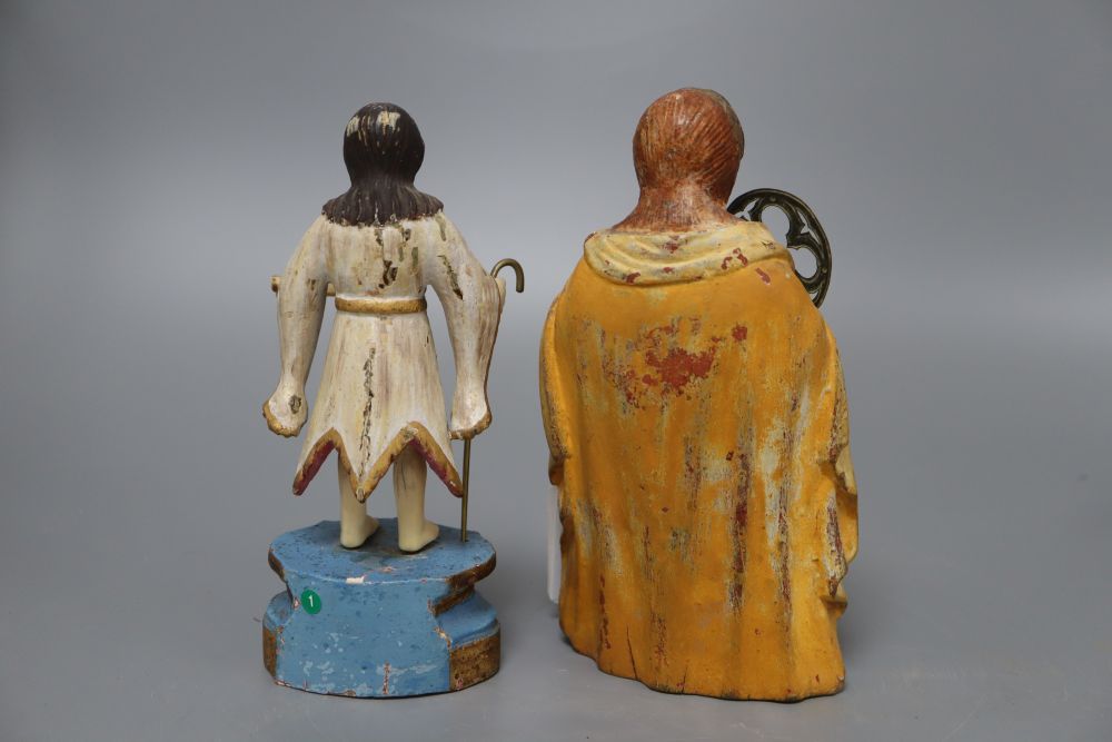 A painted carved wood religious figure of a kneeling saint and a similar painted carved wood and ivory figure, tallest 19cm